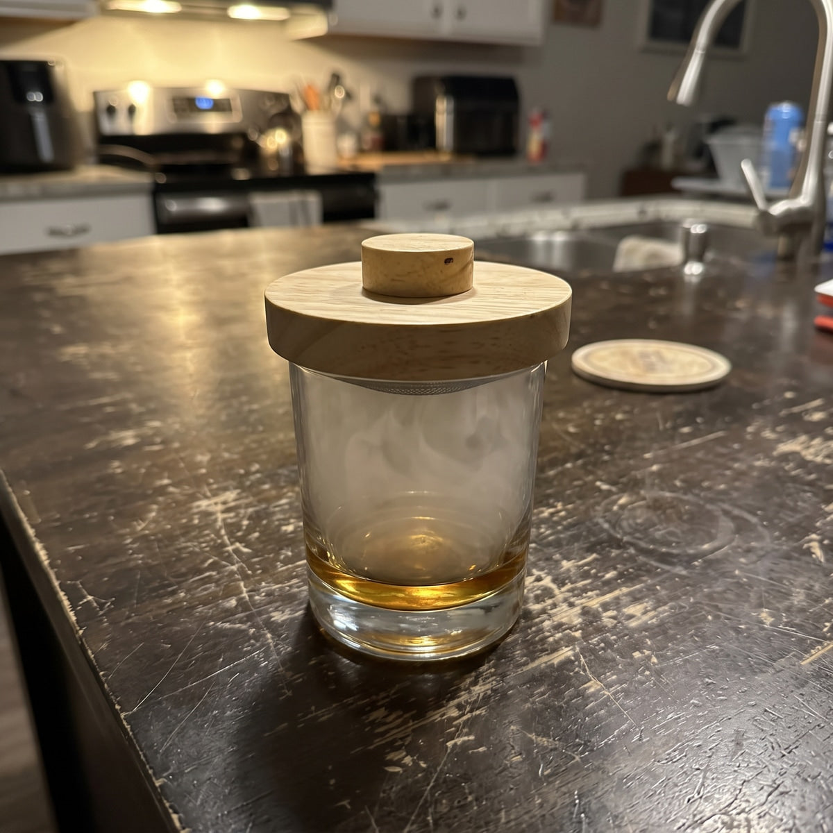 Smoker on whiskey at a kitchen island