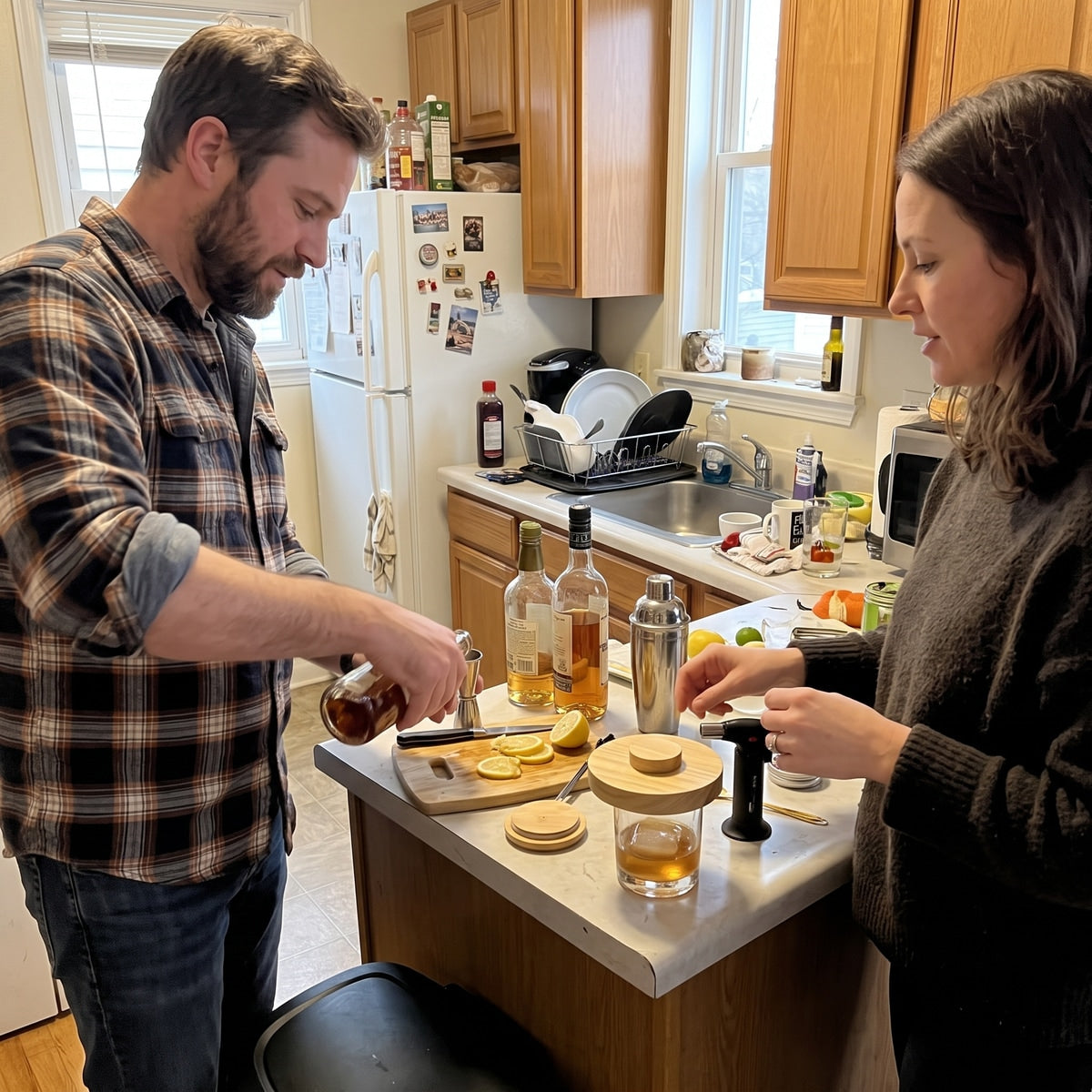 Two adults preparing cocktails at home