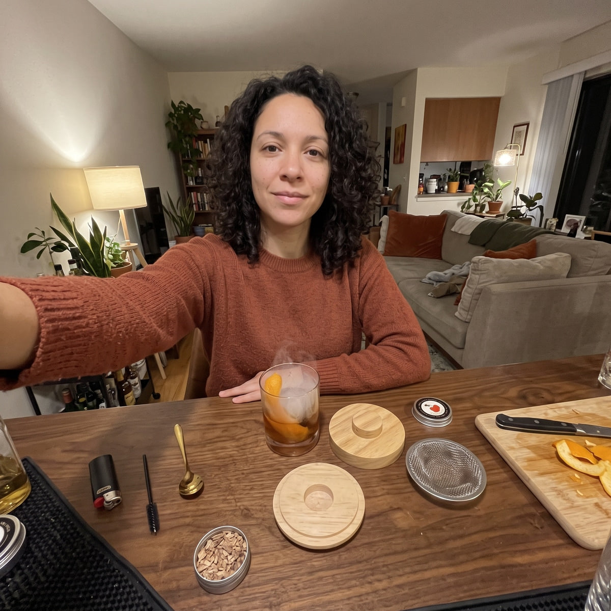 Sophie L. with a cocktail at her home bar